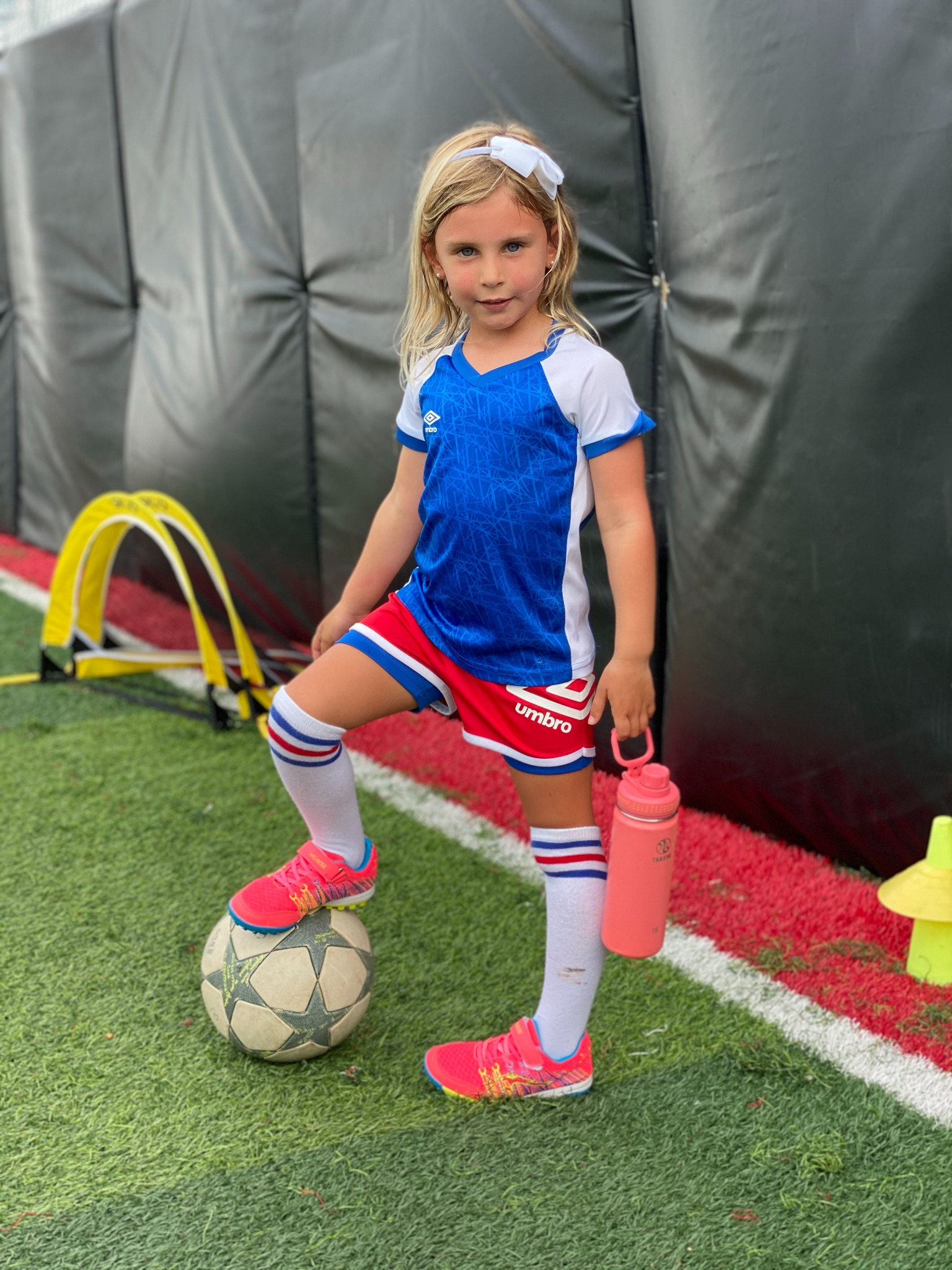 Young girl with soccer ball from MBYSF's supplied story deck